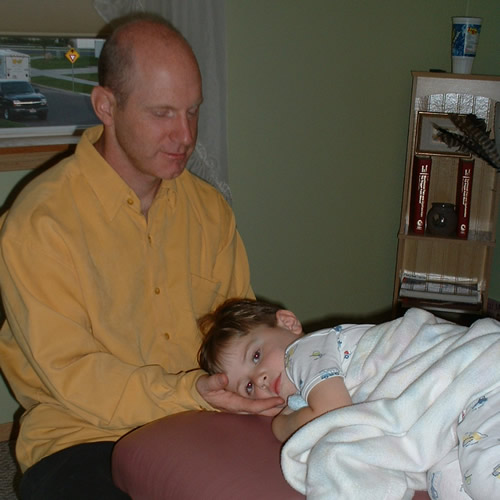 Dr. Donald Williams treating a child